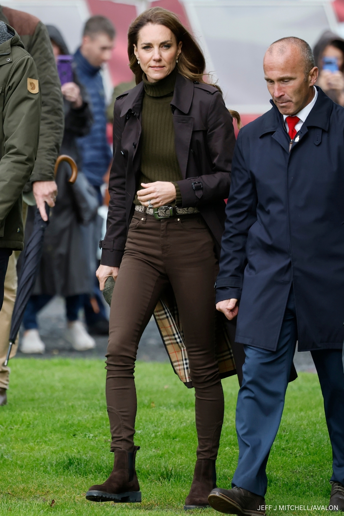 Kate Middleton wearing an olive roll-neck and brown Burberry trench coat on the Isle of Bute